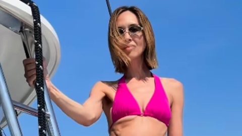 Myleene Klass, 48, looks joyous as she models a number of bikinis during a celebratory yacht trip after ‘terrifying’ breast cancer scare