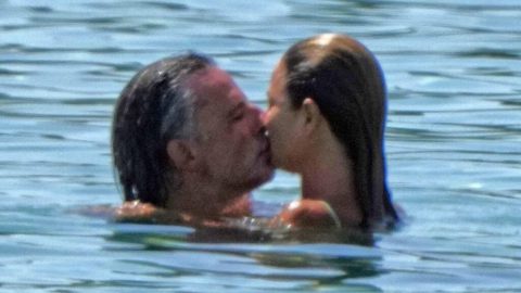 Bikini-clad Dina Broadhurst, 50, confirms new age-appropriate romance with wealthy German artist, 48, as they kiss at the beach in Ibiza after her split from toyboy lover Danny Tchalaby