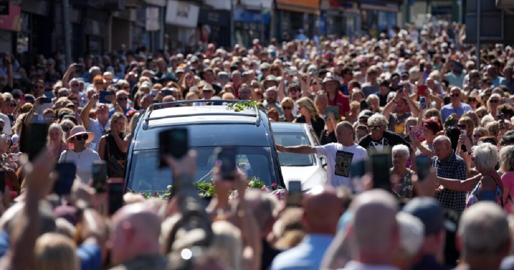 Bonnie Tyler fans line the streets of a Welsh village as her coffin is brought home, Entertainment News