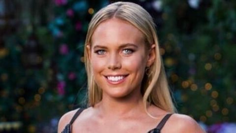Bachelor star Cass Wood is every inch the Baywatch babe as she announces pregnancy in red swimsuit