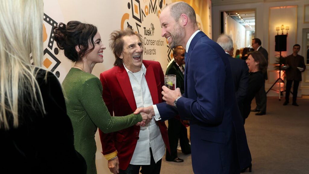 Ronnie Wood, 78, and his glamorous wife Sally, 47, share a laugh with Prince William at the star-studded Tusk Conservation Awards in London
