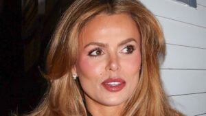 Brooks Nader turns heads in a cut out minidress and leopard print fur coat as she enjoys glamorous girls’ ski trip