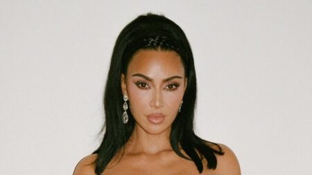 Kim Kardashian shows off her curves in a vintage strapless silver dress from Thierry Mugler’s 1986 archive as she shares more snaps from her family’s lavish Christmas Eve party