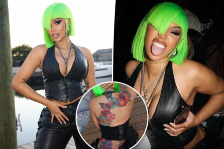Cardi B shows off new neck and back dermal piercings in plunging second-skin leather look