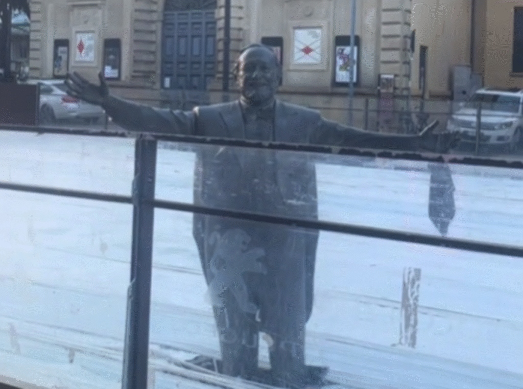 Pavarotti statue left knee-deep in ice rink