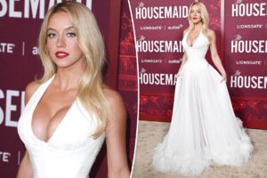 Sydney Sweeney turns up the heat in plunging white gown at ‘Housemaid’ premiere