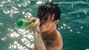 ‘Nude artist’ Dina Broadhurst, 50, strips for X-rated selfie after partying with naked rocker Yungblud, 28, aboard yacht in Sydney – before joining him backstage