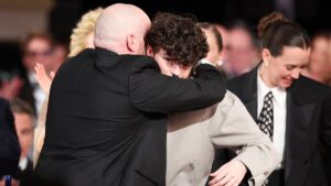 Owen Cooper’s teary-eyed Adolescence co-star Stephen Graham and proud dad Andy watch on as the star teen makes history as youngest-ever winner at Golden Globes – and leaves Hollywood crowd baffled by finishing his speech with ‘you’ll never walk alone’