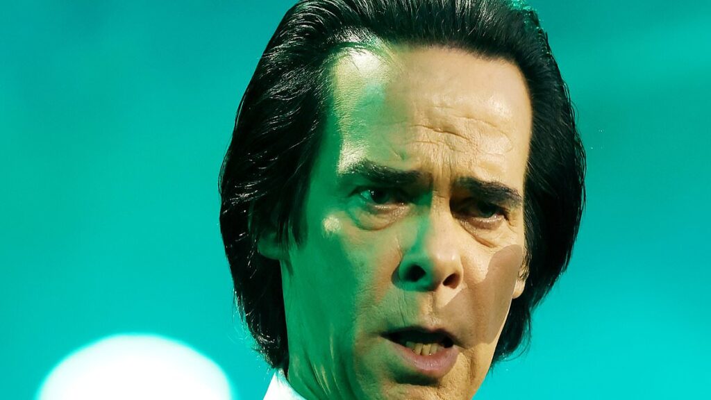 Nick Cave stuns at sold-out Sydney concert as fans reach for the rock god on triumphant return to the stage