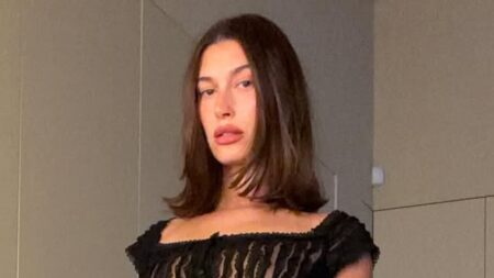 Hailey Bieber flashes taut abs in sheer top as husband Justin ventures to Aspen for guys-only trip