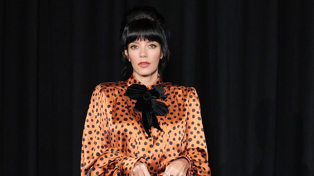 Lily Allen turns heads in a bold 60s inspired outfit as she joins Dakota Johnson at the star-studded Valentino show during Paris Fashion Week