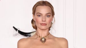 Margot Robbie stuns in Elizabeth Taylor’s iconic necklace as she is joined by Jacob Elordi at Wuthering Heights premiere in LA