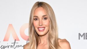 Bec Judd channels summer chic in a floral blue dress as she leads celebrity arrivals for Australian Open’s Inspirational Event