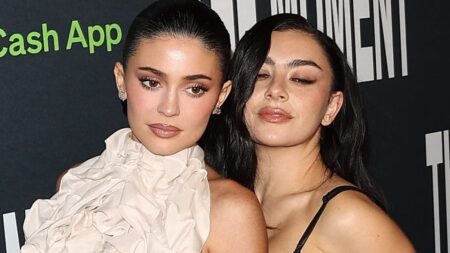 Kylie Jenner leaves Timothee Chalamet at home as she joins scantily-clad Charli XCX at premiere of The Moment… marking her acting debut