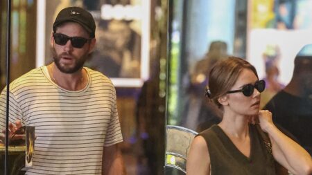 What a gentleman! Liam Hemsworth shows off his chivalrous side, opening the door for fiancée Gabriella Brooks as they leave Melbourne hotel