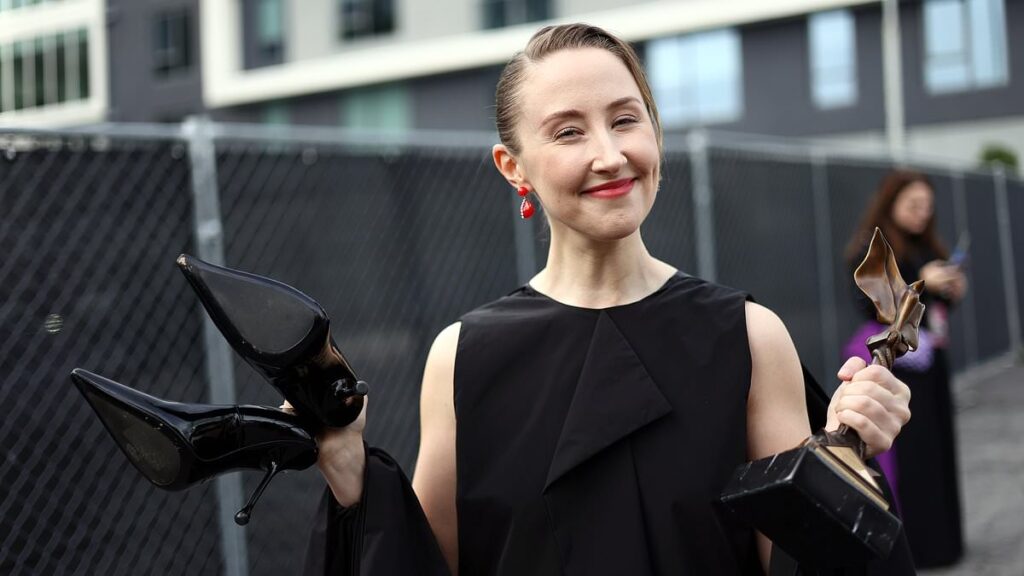 Adolescence star Erin Doherty accepts trophy barefoot as both her heels go flying on her way to the stage after winning Best Supporting Performance at Independent Spirit Awards