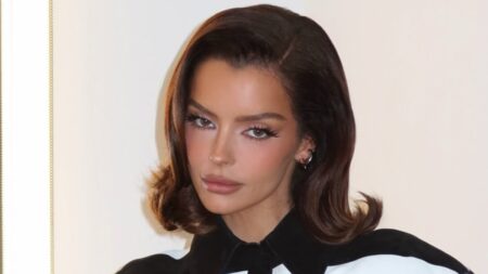 Maura Higgins shows off her tiny waist in a monochrome striped minidress while mingling with Lisa Rinna in LA as she continues to crack the US