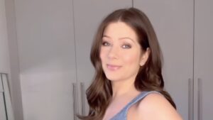 Nikki Sanderson shows off her growing baby bump in a cropped bra top as she reflects on her pregnancy