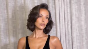 Maya Jama wows in a figure-hugging black dress as she jets back to South Africa for Love Island: All Stars