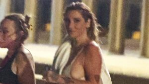 Kesha puts on a racy display as she strips down to her underwear for a very late night swim at Bondi Beach as she kicks off Australian tour