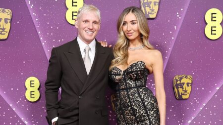 Sophie Habboo wows in a strapless black lace dress as she poses with husband Jamie Laing while leading the early arrivals at the BAFTAs 2026