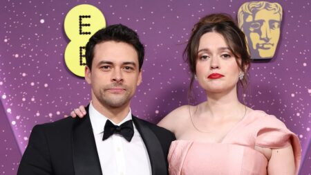 Aimee Lou Wood is the epitome of elegance in a stunning pink gown as she make a rare red carpet appearance with boyfriend Adam Long at the star-studded BAFTAs