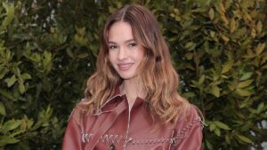 Lily James puts on a leggy display in a chic leather mini dress as she joins Ewan McGregor’s nepo baby daughter Clara leading the stars at the Tod’s show amid Milan Fashion Week