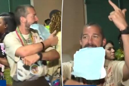 Shia LaBeouf mocks his arrest as he dances with jail paperwork in his mouth