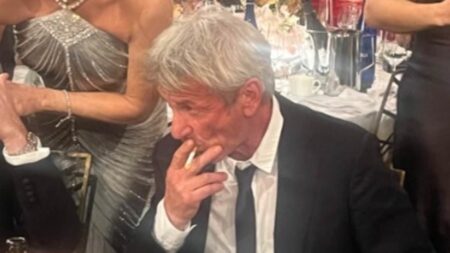 Fans turn on Sean Penn as he wins third-ever Oscar and snubs ceremony… after Golden Globes smoke break