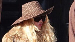 Madonna, 67, looks effortlessly chic sipping on an espresso while wearing a giant Louis Vuitton hat in Venice