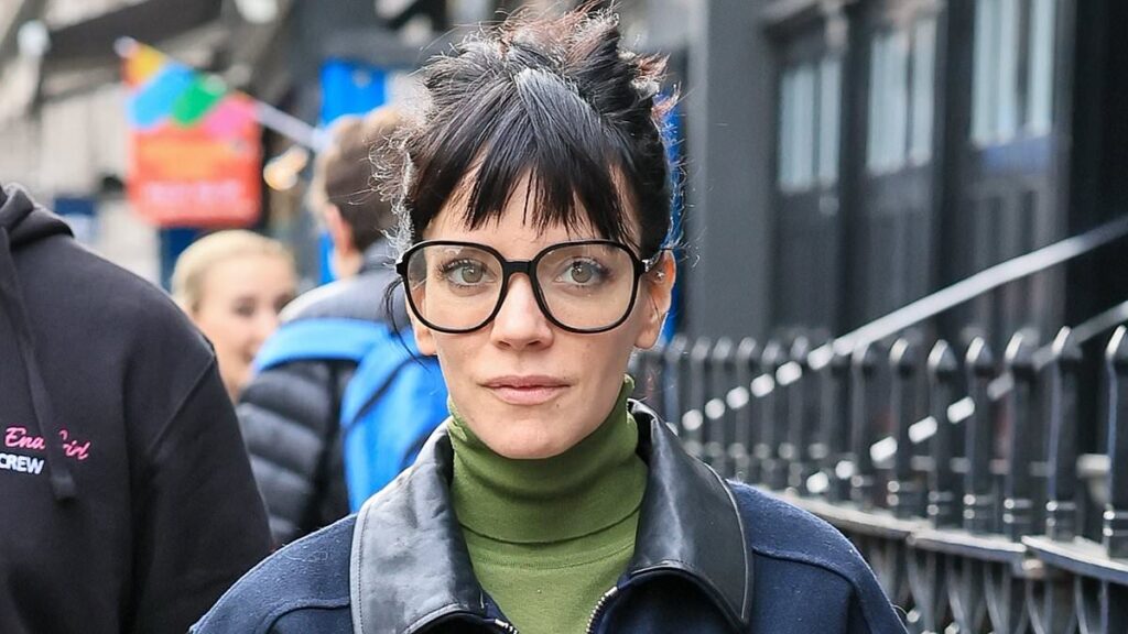 Lily Allen puts on a leggy display in a skimpy black mini skirt with Miu Miu jacket and totes £10K Chanel handbag as she arrives for her final West End Girl show in London