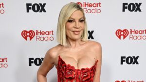 Tori Spelling, 52, puts on a busty display in racy corset gown at 2026 iHeartRadio Music Awards