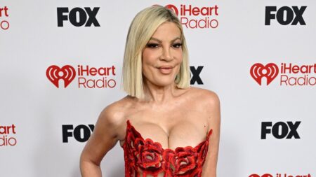 Tori Spelling, 52, puts on a busty display in racy corset gown at 2026 iHeartRadio Music Awards