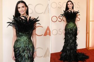 Demi Moore is covered in feathers on Oscars 2026 red carpet