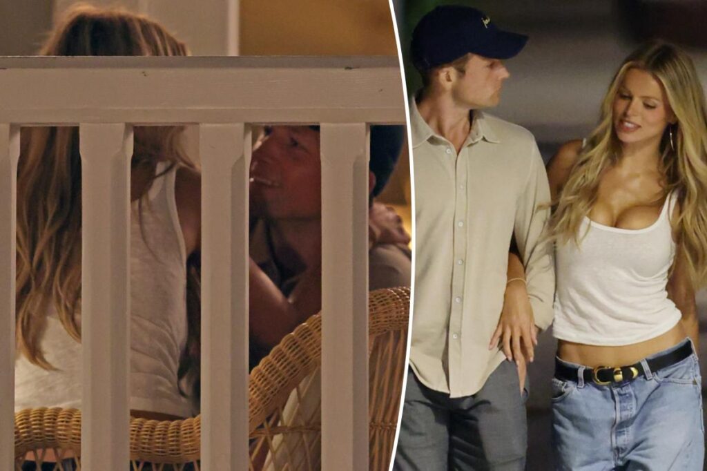 Taron Egerton can’t keep his hands off Brooks Nader during steamy beachside date