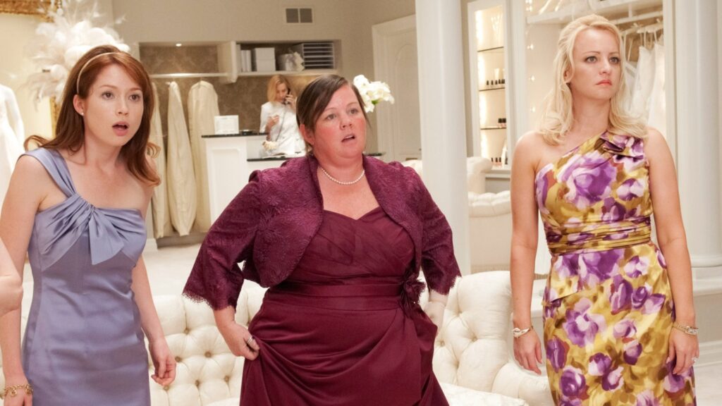 ‘Bridesmaids’ Star Wendi McClendon-Covey Clears Up Her Absence From Oscars Reunion: “I Had a Neck Lift… No Drama”
