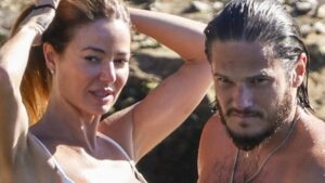 Dina Broadhurst, 50, puts on a very raunchy display as she goes topless at the beach and packs on the PDA with her new toyboy beau