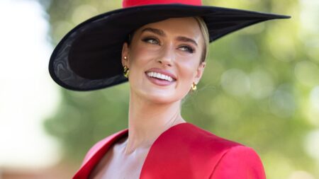Grace Hayden cuts a VERY glamorous figure as she steps out in a bright red frock during The Championships at Royal Randwick Racecourse