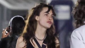 Cara Delevingne looks unrecognisable as she displays long wavy brunette locks and curtain bangs at Coachella