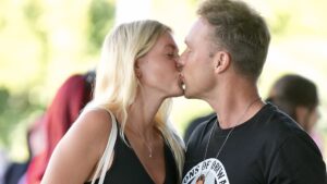 PDA alert! Lincoln Lewis packs on the affection with his fitness coach girlfriend Emmi Schmidt as the couple go public at Supanova on the Gold Coast