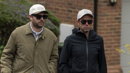 Scott Mills shows the strain as he is seen for the first time since being sacked by BBC over historical allegation of serious sexual offences as he walks dog with husband Sam Vaughan