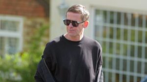 Scott Mills steps out for a dog walk with his husband as friends reveal the DJ is in ‘crisis’ after being fired by the BBC over historical allegation of serious sexual offences