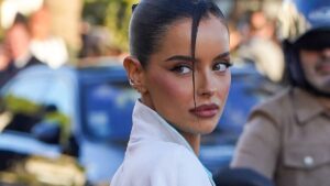 Maura Higgins struts through Cannes in an 80s-style white power suit and heels as she swaps reality TV for private jets and the iconic Film Festival