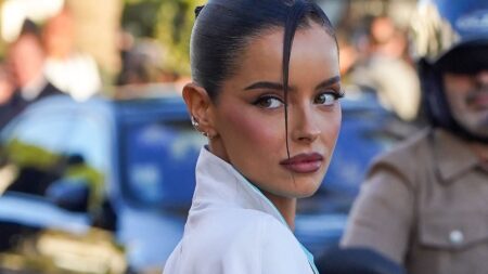 Maura Higgins struts through Cannes in an 80s-style white power suit and heels as she swaps reality TV for private jets and the iconic Film Festival