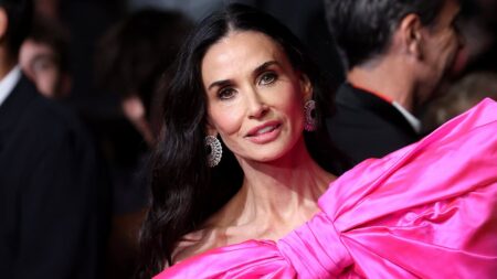Demi Moore makes sure all eyes are on her in dramatic pink bow dress as she joins pregnant Barbara Palvin at star-studded Paper Tiger premiere during Cannes Film Festival