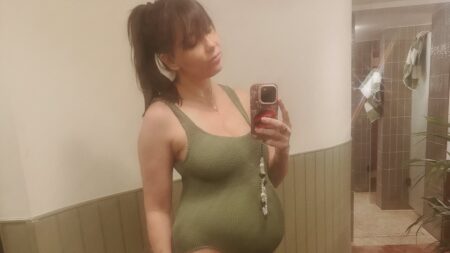 Pregnant Daisy Lowe shows off her bump in a khaki swimsuit as she celebrates reaching the third trimester: ‘Made it to full waddle status’