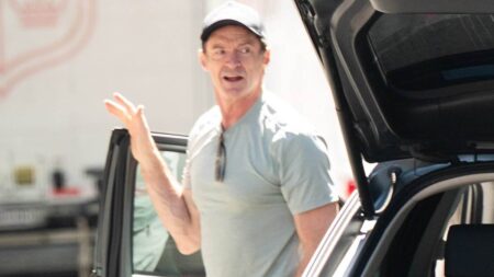 Hugh Jackman and Sutton Foster ignite rumors they LIVE together as they load suitcases together