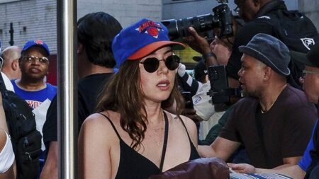 Pregnant Aubrey Plaza displays her baby bump in a black maxi dress as she attends Knicks game with boyfriend Christopher Abbott
