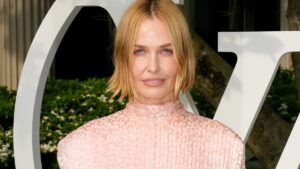 Lara Worthington turns heads in Louis Vuitton gown worth $27,300 – but would YOU wear this dress?