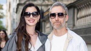 Anne Hathaway’s rarely-seen husband joins her for fancy fashion event but is severely underdressed in jeans and sneakers